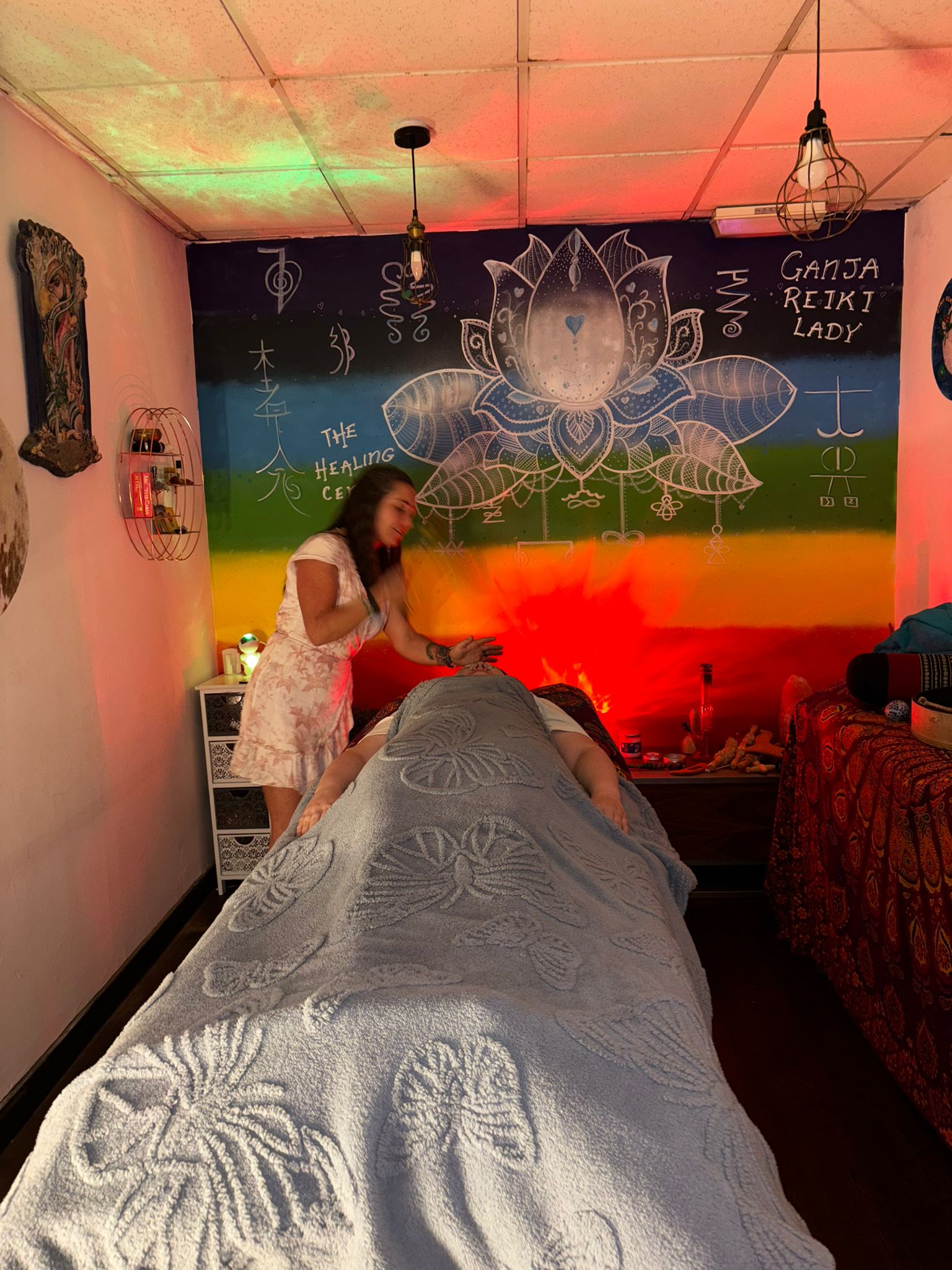 Claire performing Ganja Reiki in the treatment room